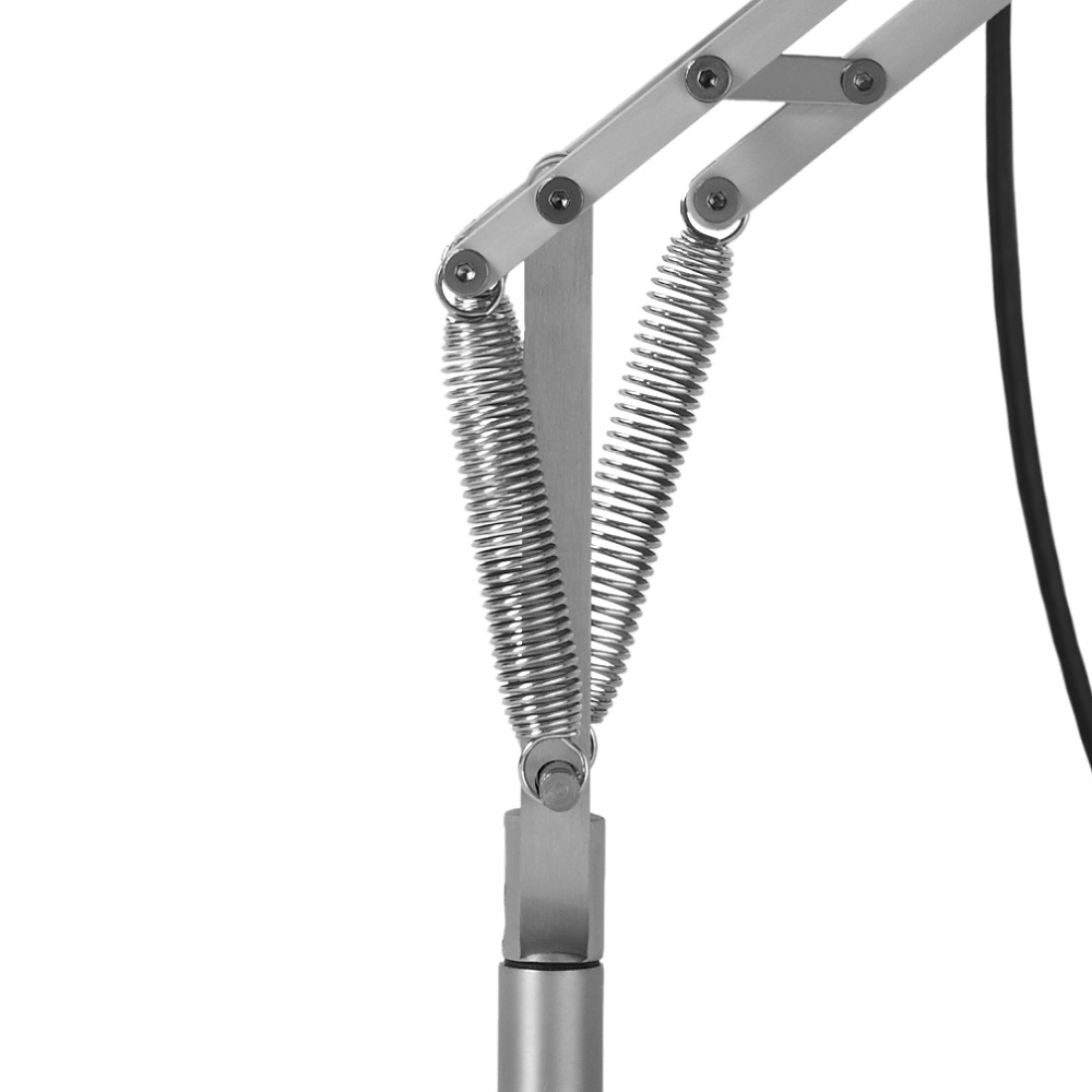 Detailaufnahme der silbernen Anglepoise Type 75 Tischleuchte, die Federn und Gelenke des Arms zeigt.