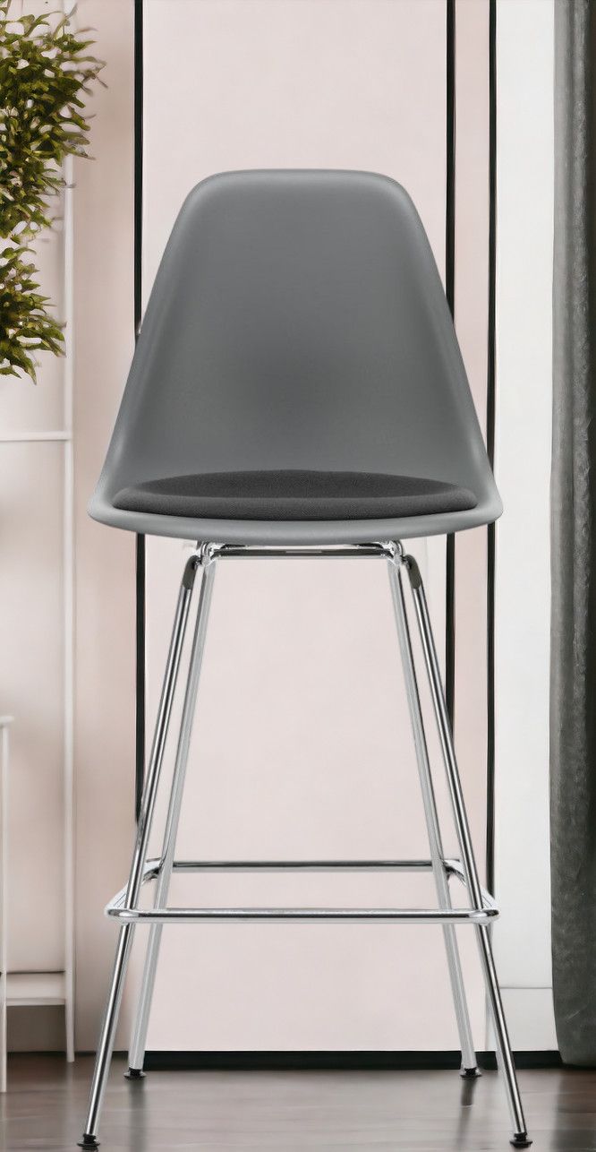 Eames Plastic Bar Stool Tabouret de bar moyen avec coussin d'assise Vitra